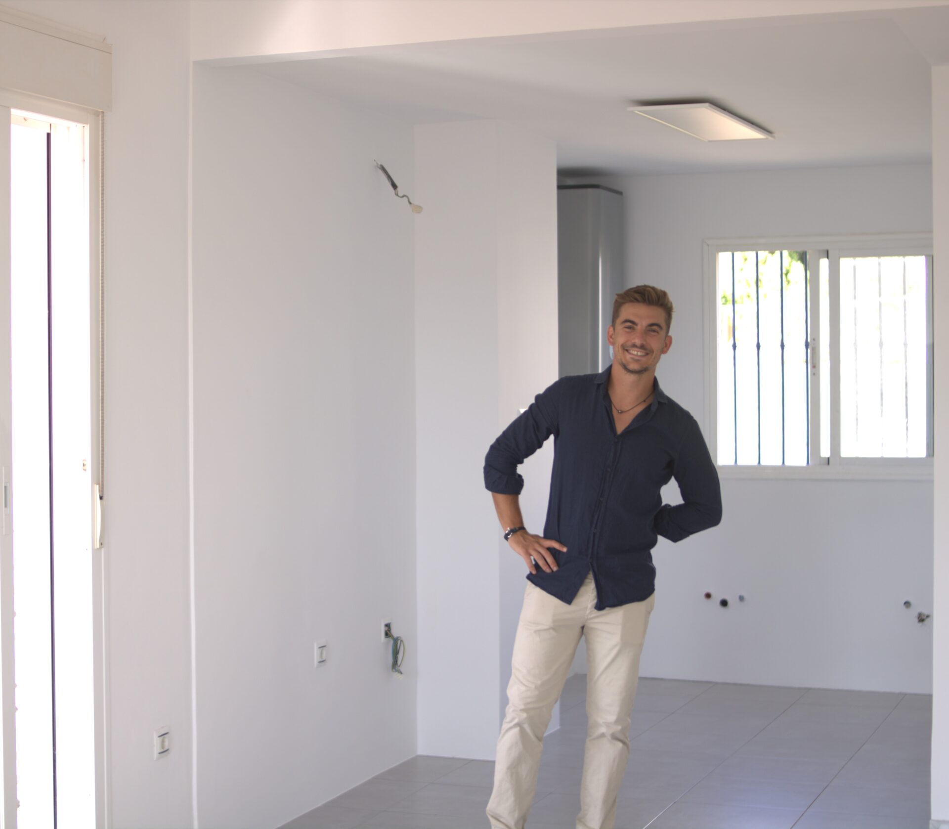 Person standing in an unfinished kitchen space, from LookHome’s Calahonda project media